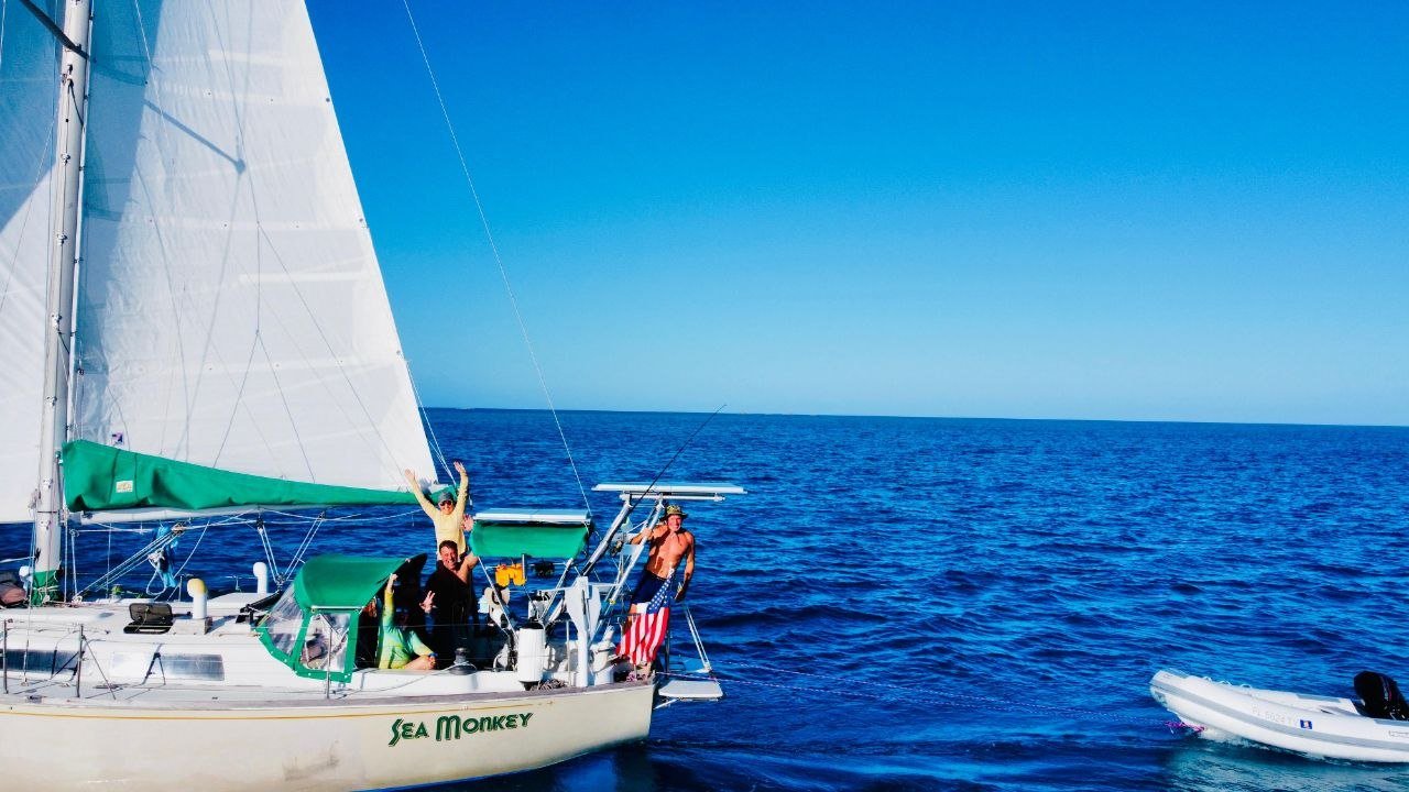 Crew waving from Sea Monkey